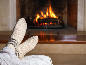 Resting on mattress in front of fireplace